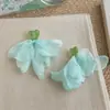 Pendientes frescos y dulces estilo vacacional con borlas florales, borlas de perlas estilo francés, pendientes llamativos de lujo ligero y alta gama