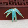 Yiwu cor raio de ouro cobre banhado a ouro DIY ponto esmeralda imitação ouro queima azul esmalte folha de bambu furo único acessórios de lâmina B3364