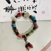 Suministro de fábrica estilo nacional arte hecho a mano cerámica círculo único estilo nacional retro irregular Red social pulsera joyería