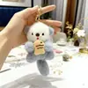 Lindo Peluche de Nutria Colgante con Pez, Llavero para Bolso de Castor, Adorno de Muñeco, Nutria Marina Sosteniendo un Pez