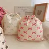Bolsa de tela de algodón con cordón y estampado de lazo bolsa de almacenamiento para viajes clasificación en casa bolsa de algodón al por mayor