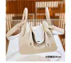 Nuevo Bolso Lindy Primavera/Verano 2024 Bolso de Hombro Cruzado de Moda Patrón de Lichi Piel de Vaca Togo Tc Bolso de Médico Mini