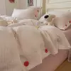 Conjunto de quatro peças estilo minimalista 100% algodão Classe A com botões, lençol de cama listrado em fio de algodão tingido puro lavado, capa de edredom individual, conjunto de três peças para dormitório 4