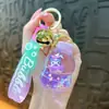 Nuevo llavero de biberón transfronterizo, exquisito colgante de arena líquida, accesorio de llavero para bolso, pequeño regalo, venta al por mayor de comercio exterior
