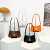 2025 Nueva Moda Color Sólido Francés Nicho Casual Bolso Baguette Debajo del Brazo Bolso de Mano para Mujer Elegante Bolso de Hombro Cruzado