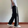 Calça Casual Listrada Estilo Americano Transfronteiriça para Homens Nova Coleção Primavera e Outono 2026 Calças Longas Largas para Adolescentes e Estudantes Roupa Masculina