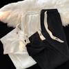 Pantalones cortos holgados de primavera y otoño para hombre, rectos, de marca de moda, pantalones casuales, pantalones deportivos, color sólido, microelásticos, para jóvenes.