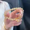 2025 Novo Estilo Acessível Luxo Retrô High-End Elegante Clareador Pulseira Nova Chinesa Imitação Ouro Baguete Gato Pulseira para Mulheres