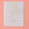 Pegatinas 3D estéreo transfronterizas de nuevo diseño con borde plateado para decoración de uñas, con 12 colores de letras inglesas, disponibles en varios tamaños, y son pegatinas removibles para decoración de uñas.