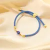Europa y Estados Unidos pulsera ojo azul transfronteriza cuerda de mano ojo del diablo retro pulsera ojo tejida a mano ajustable venta al por mayor