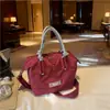 Bolso de mano de nicho estilo coreano, nuevo bolso de hombro versátil para el día a día, bolso cruzado ligero para salir, bolso de tela de comercio exterior de moda
