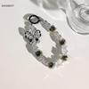Cadena para teléfono móvil estilo Ins Versátil Lanyard colgante para funda de teléfono móvil para mujer Anti-caída Lanyard corto Ccd Cadena colgante de dopamina