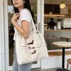 {Modelo de Copyright} Chapéu Bordado Ins com Bolsa de Ombro de Cachorro, Bolsa de Compras Feminina Fashion e Versátil, Bolsa Tote com Cordão de Grande Capacidade