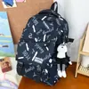 Mochila Casual Azul Hielo con Graffiti de Letras Casuales, Estilo Juvenil, Moderna y Genial, Mochila de Gran Capacidad para Estudiantes de Secundaria y Preparatoria