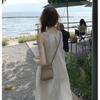 Vestido de verano para mujer, estilo coreano, de alta gama, blanco, para vacaciones, color liso, sin mangas, largo medio, cintura ajustada, vestido de vacaciones.