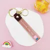 Llavero Colgante de Cordón de Cuero con Letra Transparente Brillante con Accesorios Estilo Muñeca Rellena de Aceite Encanto de Llavero Pulsera Venta al por Mayor