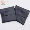 2025 Nueva Bolsa Plegable de Cuero PU Negra Simple Portátil Bolsa para Auriculares Bolsa de Almacenamiento para Joyas y Llaves