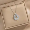 Collar para mujer de acero de titanio con colgante redondo de diseño de nicho minimalista, europeo y americano transfronterizo, de alta gama, con incrustaciones de circonita