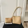 Moda transfronteiriça popular simples para o dia a dia bolsa de palha trançada design de nicho bolsa de ombro estilosa grande capacidade bolsa de ombro único