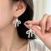 Pendientes de lazo de encaje estilo francés con perlas para mujer, moda de lujo ligero con un toque de alta gama y elegancia
