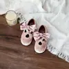 Zapatos de Princesa de Terciopelo con Lazo Cruzado Estilo Coreano para Niñas 2026 Otoño/Invierno Nuevos Zapatos Individuales Versátiles de Suela Blanda para Niños