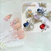 Celebridad de Internet Nuevo Estilo Lazo Diamante Octagonal Largo Cuadrado Diamante Arte de Uñas Joyería Azúcar de Roca Súper Brillante Aleación Decoración de Uñas Venta al por Mayor
