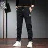 Pantalones casuales nuevos para primavera y otoño 2024, overol para hombre, bordado chino de calidad, cintura elástica, pantalones largos para hombre