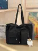 Transfronterizo 2026 principios de otoño nuevo nailon negro simple ligero doble bolsillo bolso de mano bandolera venta al por mayor