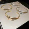 Brazalete abierto de doble capa con lazo de circón, temperamento exquisito francés, brazalete Joker, joyería de lujo ligero de alta gama, venta al por mayor