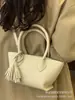 Bolso de Mano de Moda de Gama Alta 2026 Nuevo Modelo Versátil para el Trabajo Cruzado Bolso Cubo Pequeño Exquisito de Moda