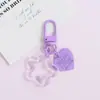 Llavero con hebilla de puerta giratoria, colgante de pentagrama y corazón transparente de colores, accesorio hecho a mano para bolsos