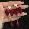 Pendientes de Borlas con Lazo Rojo 2026 Nuevo Estilo Caliente Lujo Ligero Gama Alta Pendientes de Año Nuevo Accesorios de Oreja Únicos de Nicho