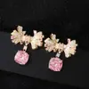 Pendientes de Tachuela de Circonita con Lazo Multicolor Temperamento Elegante de Gama Alta Azúcar Cubo Circonita Pendientes Coloridos de Comercio Exterior