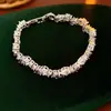 Pulseira Europeia e Americana Transfronteiriça com Fivela Torcida de Zircônia, Estilo Exclusivo de Nicho, Pulseira Versátil, Luxo Leve, Sensação de Alta Qualidade, Joias Femininas