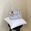 Bolsa de Mão Estilo Coreano Retrô Padrão Lichia Transfronteiriça para Mulheres 2026 Nova Coleção de Primavera Bolsa de Ombro Bolsa Saco Crossbody de Alta Qualidade