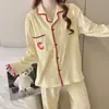 Cardigan de punto de imitación de algodón de alta densidad para principios de otoño, conjunto de pijama de manga larga y pantalón largo para mujer con copas en el pecho, ropa de casa linda, transfronterizo