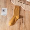 Calcetines apilados al por mayor otoño e invierno color tierra retro color sólido calcetines de tubo para mujer estilo japonés con calcetines de punto para mujer marea ins