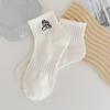 Calcetines Zhuji para mujer, calcetines de longitud media, primavera y verano, estilo americano, marca de moda, calcetines altos bordados, calcetines largos y cortos con bolsa de expresión para mujer, calcetines de algodón