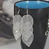 Recolección Transfronteriza de Pendientes Metálicos con Hojas Geométricas Escarchadas, Ganchos para Orejas Creativos Personalizados con Borla de Hoja Redonda Hueca