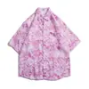 Camisa Casual Solta de Manga Curta com Gola Pontuda Estampada Estilo Havaiano para Jovens no Verão 2025 Nova Leve
