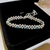 Pulseira Redonda com Zircônia e Pérolas Francesas com Fio Ajustável Levemente Luxuosa Sensação de Alto Padrão Senso de Design Pulseira Joia de Mão de Nicho Feminina