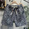 Guangzhou Trece Líneas Modernos Nuevos Pantalones Cortos Jacquard Simples para Hombre Sueltos Pantalones de Playa Moda Literaria