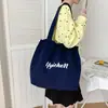 2026 Nueva Bolsa de Lona con Cordón Estilo Ins Japonés Bolso Tote Bolso de Mano Ruiying Simple Gran Capacidad Bolso Tote de Hombro