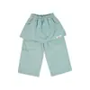 Ropa Infantil Nuomi Wanzi 2026 Otoño Pantalones Casuales de Algodón Puro para Niñas con Solapa Trasera y Etiqueta Parcheada, Pantalones Rectos, Pantalones Falda para Niños al por Mayor