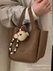 Bolsa de Mão Pequena Retrô da Moda para Mulheres 2026 Novo Modelo Versátil Bolsa Transversal Super Popular Bolsa de Balde Tote para Uso Externo