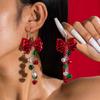 Europa e Estados Unidos cruzados fronteira Natal nova cor sino gancho de orelha senso de design CCB laço brincos criativos brincos mulheres