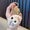 Chaveiro Câmera de Projeção de Boneca de Desenho Animado Luminoso Projetor Artificial Pingente de Bolsa Chaveiro de Chave de Carro Pequeno Presente