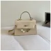 Nuevo Bolso Kelly con Patrón de Piedra Transfronterizo, Estilo de Nicho de Alta Gama, Bolso de Mano Retro Versátil y Elegante para Mujer
