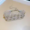 [Cadena de Diamantes Arcoíris] Pulsera de extracción de zircón trenzado en cruz, una pulsera lujosa y de alta gama, una pieza de joyería delicada y de moda
