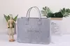 Bolso de fieltro de moda para redes sociales, gran capacidad, bolsa de mano para transmisiones en vivo, logo para mujer, regalo publicitario, bolso de fieltro para ocio y desplazamientos